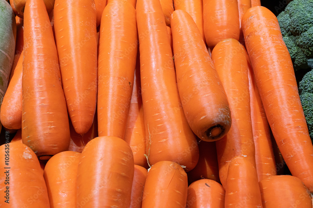 A bunch of carrots is on the shelf in Supermarket A bunch of carrots is on the shelf in Supermarket