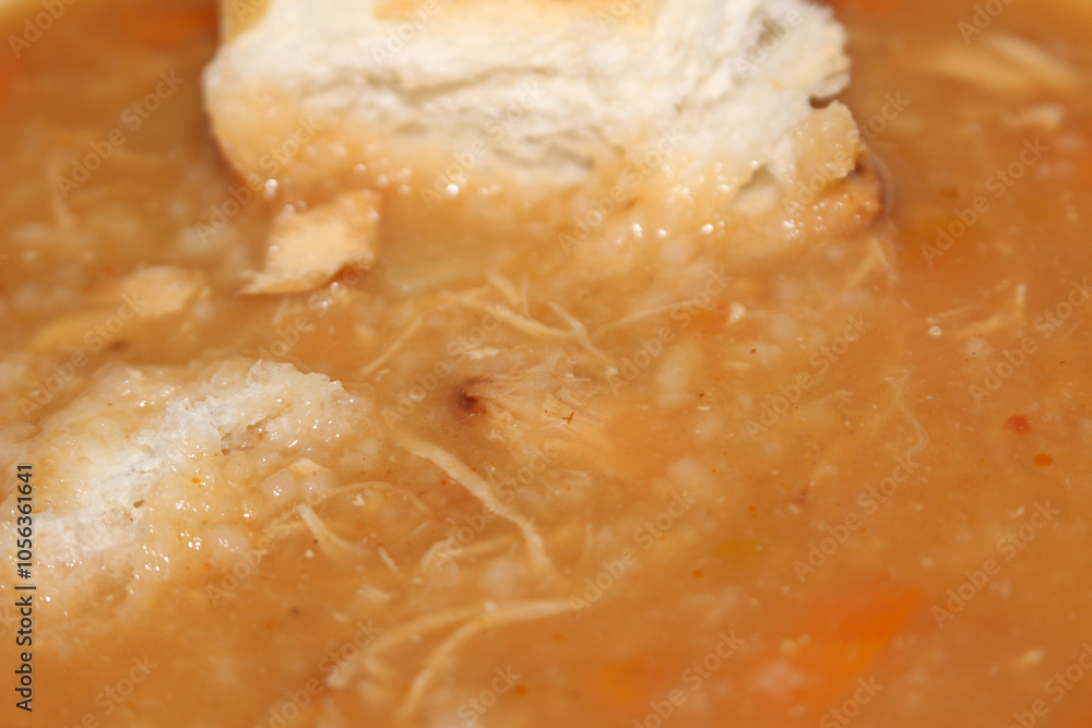 soup with bread. meal details. food background. homemade chicken soup. shredded chicken with bread, carrots and rice. soup with bread. meal details. food background. homemade chicken soup. shredded chicken with bread, carrots and rice.