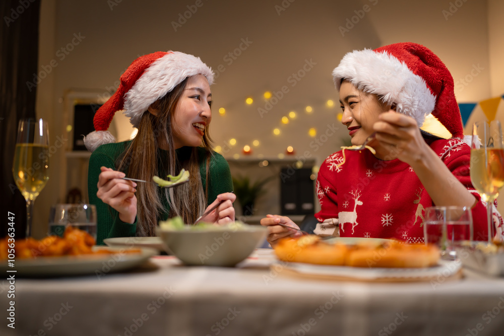 Two Asian women in room with Ciematic lighting celebrate important events such birthdays Christmas