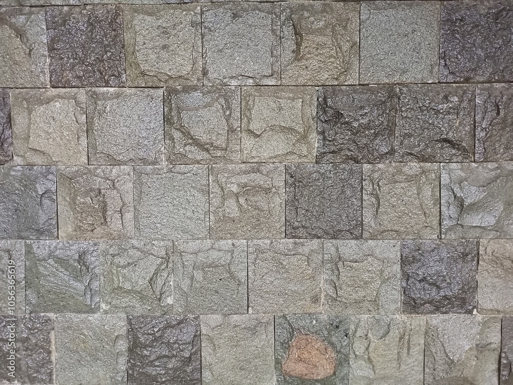 Fototapeta premium The masonry of the ancient wall consists of regular-shaped stone blocks