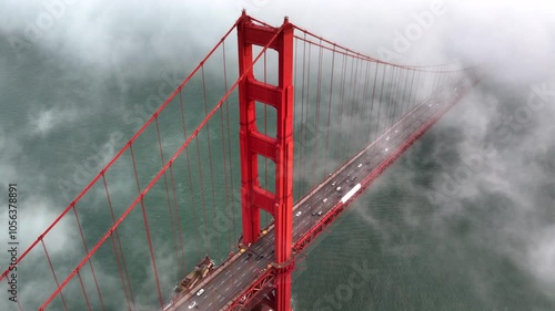 San Francisco - Thick Fog Rolling Past Golden Gate Bridge - High Aerial Shot