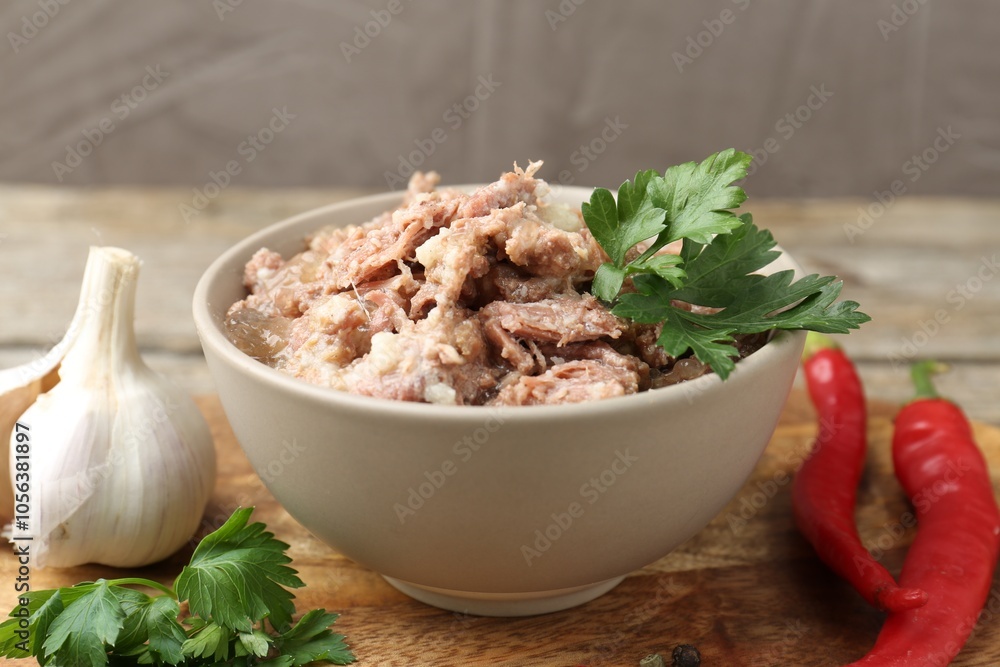 Canned meat in bowl and fresh products on table, closeup Canned meat in bowl and fresh products on table, closeup
