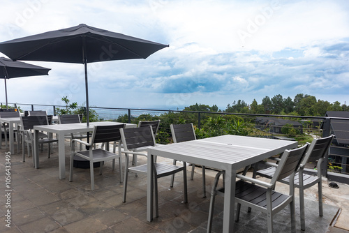 An outdoor dining area with mountain views, offering a serene setting for dining and relaxation in nature. photo