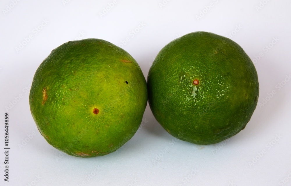 photo of fresh green lime, on white background photo of fresh green lime, on white background