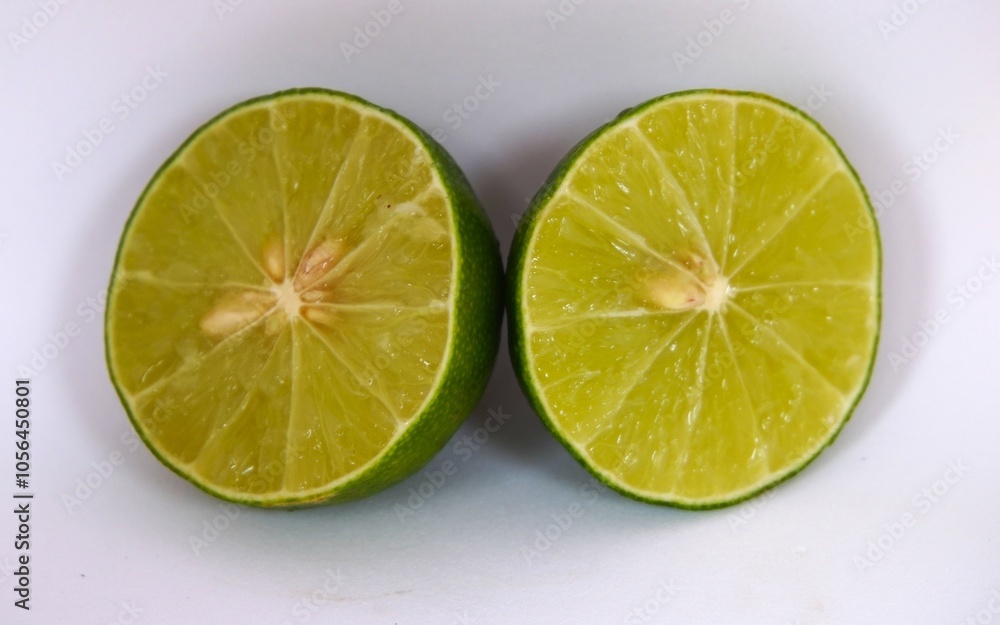 photo of sliced lime on white background photo of sliced lime on white background