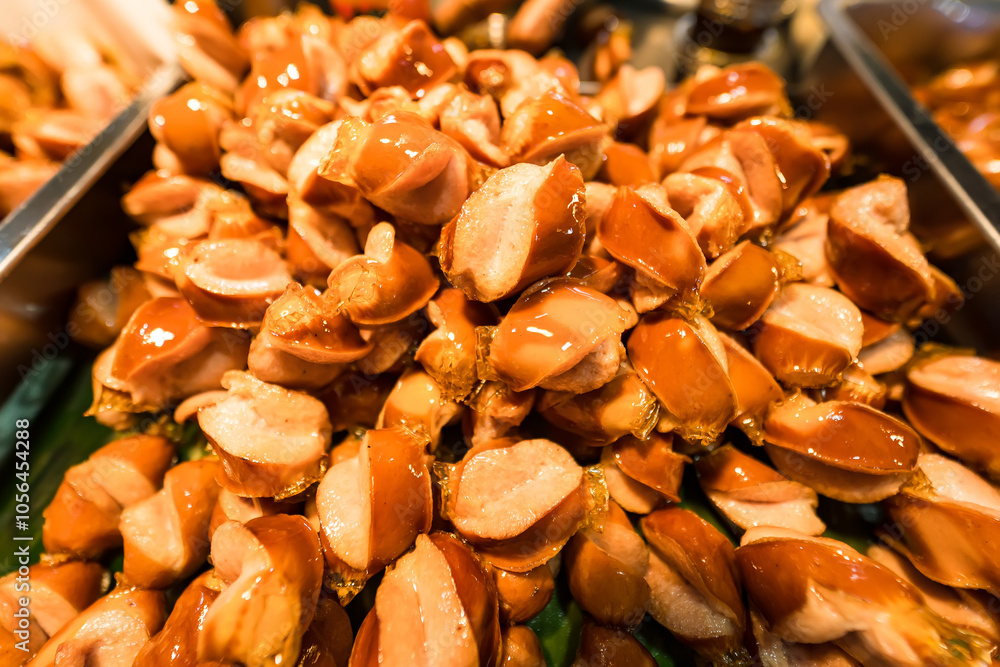 Golden Brown Fried Sausages for Sale in a Thai Street Food Market, Ready to Enjoy Golden Brown Fried Sausages for Sale in a Thai Street Food Market, Ready to Enjoy