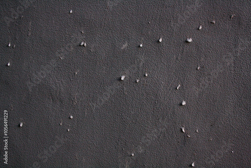 Water droplets on grey wall