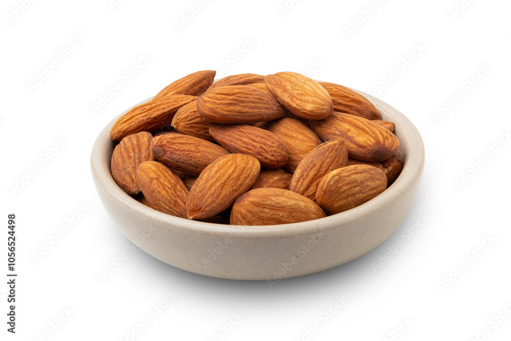 Dry roasted Almonds in white bowl isolated on white background with clipping path Dry roasted Almonds in white bowl isolated on white background with clipping path