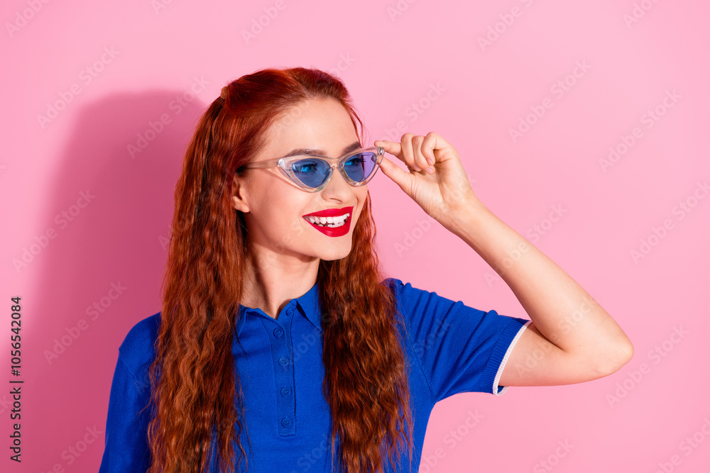 Photo of charming pretty lovely woman wear blue stylish clothes empty space isolated on pink color background Photo of charming pretty lovely woman wear blue stylish clothes empty space isolated on pink color background