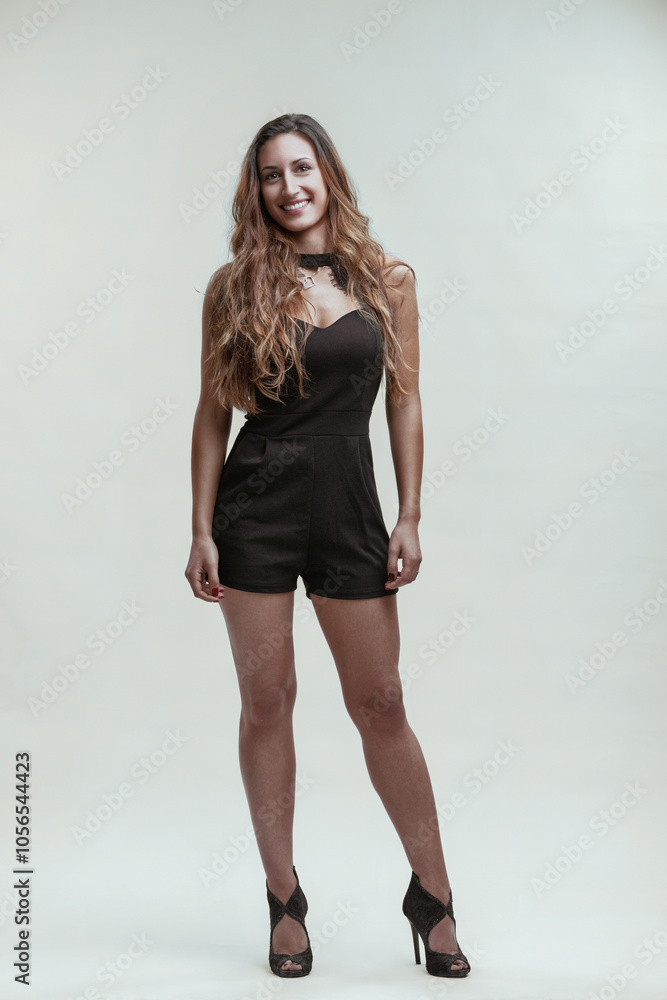 Beautiful young woman smiling and showing confidence and power Beautiful young woman smiling and showing confidence and power