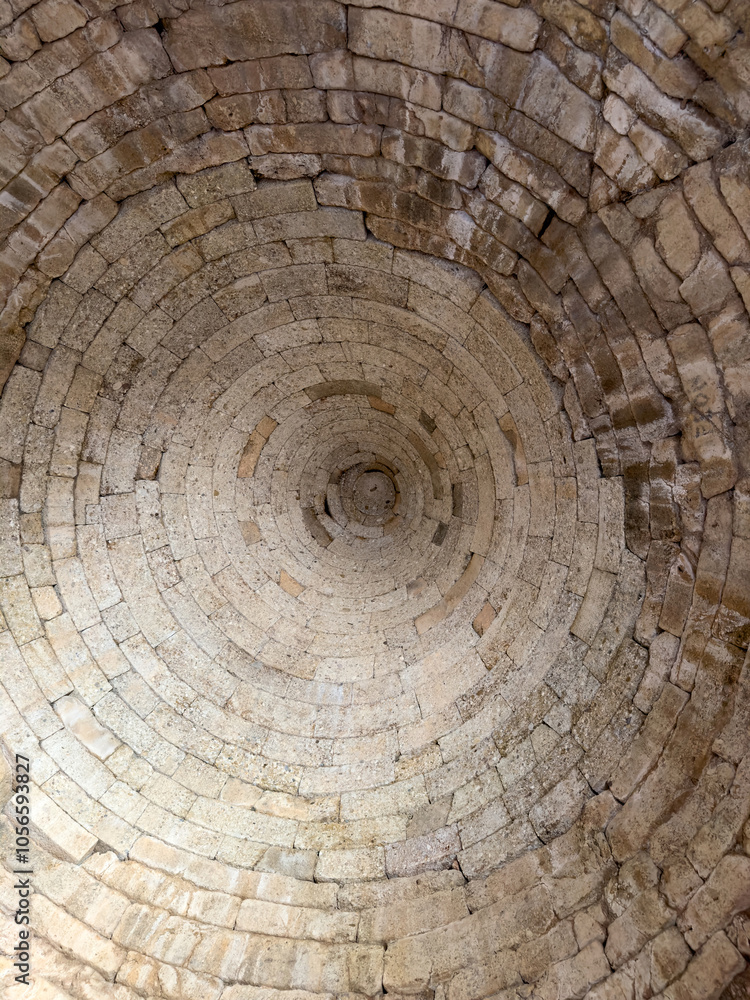 Interior of Clytemnestra Tomb at the Mycenae archaeological site, Greece. Mycenaean stone tholos roof indoor