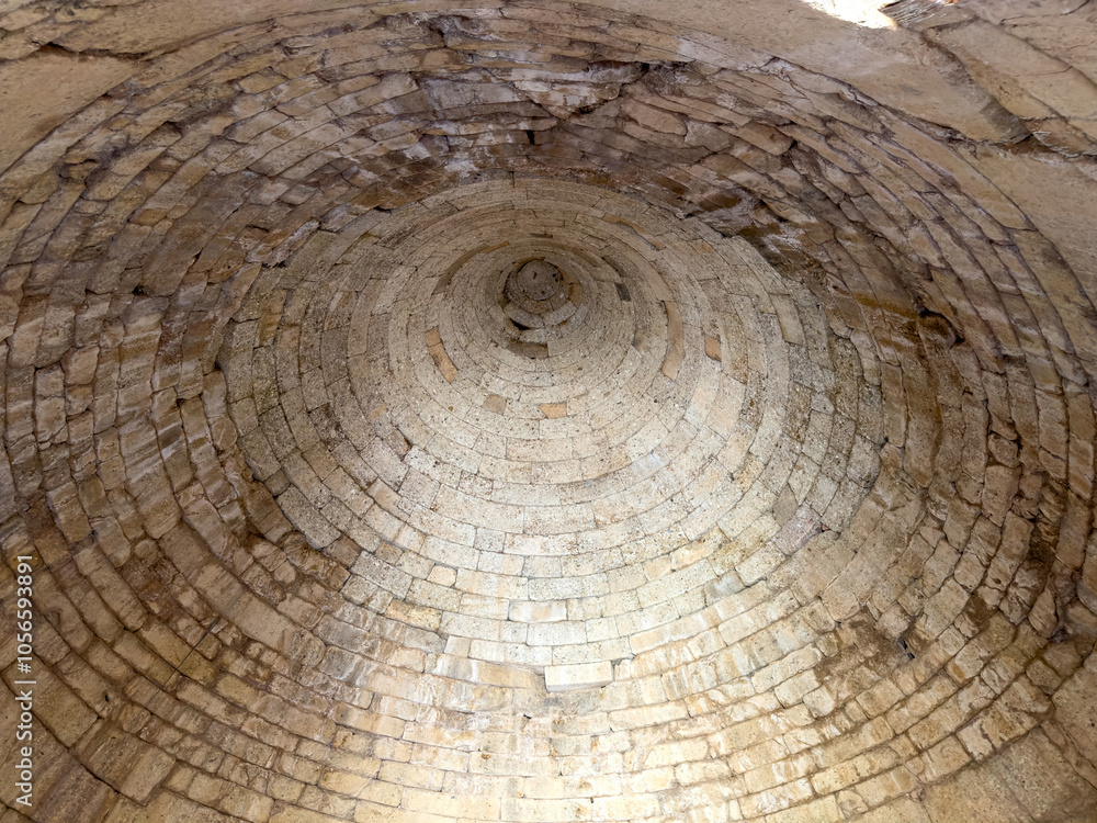 Interior of Clytemnestra Tomb at the Mycenae archaeological site, Greece. Mycenaean stone tholos roof indoor