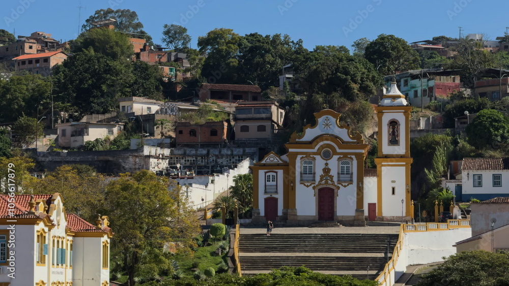 Fototapeta premium Colonial Church Facade Against a Hillside of Colorful Houses