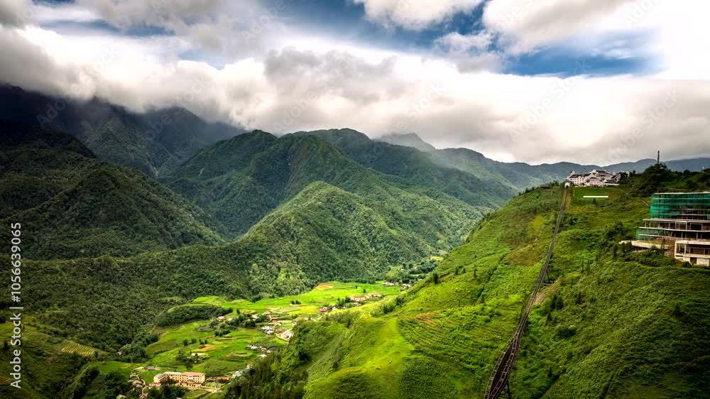 Drone hyperlapse of clouds flowing over Fansipan mountain and view of cable car Drone hyperlapse of clouds flowing over Fansipan mountain and view of cable car
