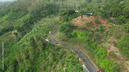 Sukabumi Mountain Road As Motorbikes Travel Uphill In Indonesia 4K 60FPS photo