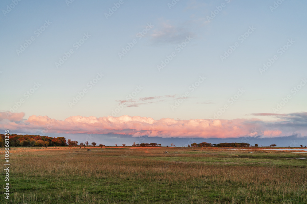 Peaceful sunset landscape with pinky clouds Peaceful sunset landscape with pinky clouds