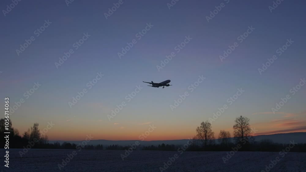 airplane flying in beautiful evening sky distant forest airplane flying in beautiful evening sky distant forest