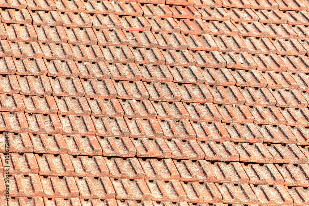 A red roof with a pattern of bricks A red roof with a pattern of bricks