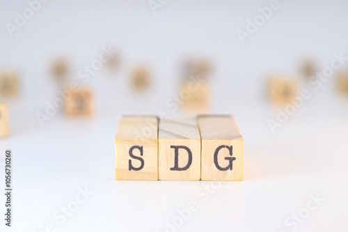 Wallpaper Mural Sustainable Development Goals - SDG acronym written on wooden cubes isolated on white background with copy space. Torontodigital.ca