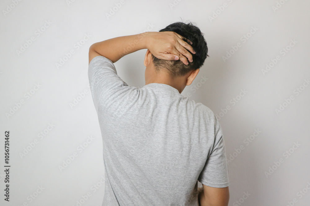 Headache and migraine, young man with head pain isolated on white background, painful area