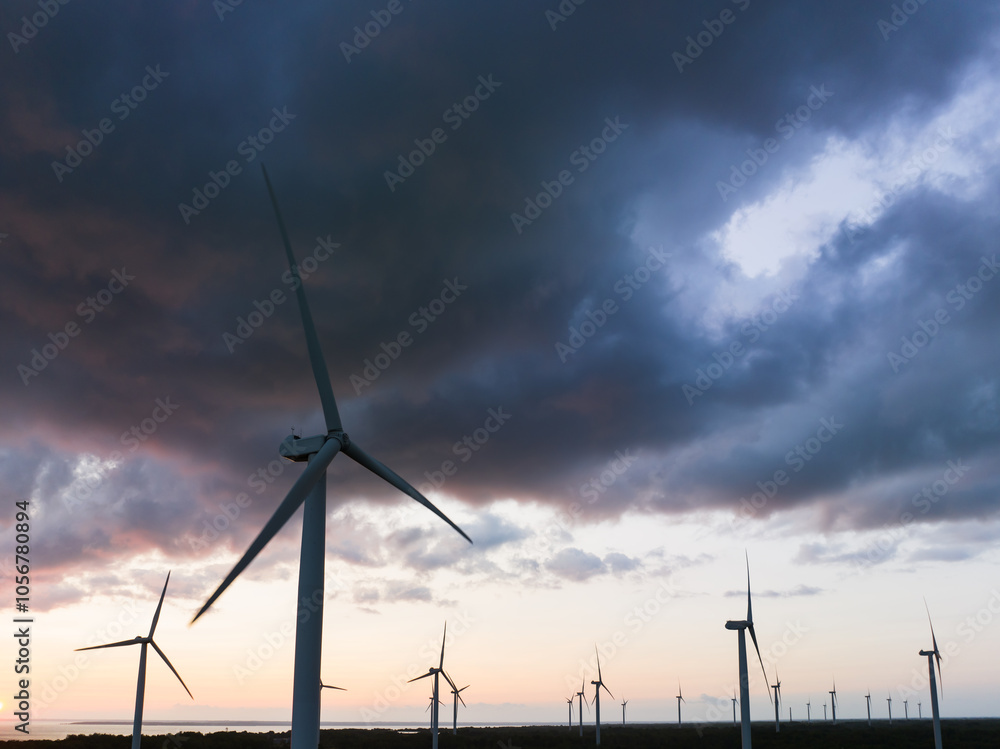 Obraz premium Wind turbines on the Paldiski peninsula during a storm, sky with dark clouds. Photo view from a drone.