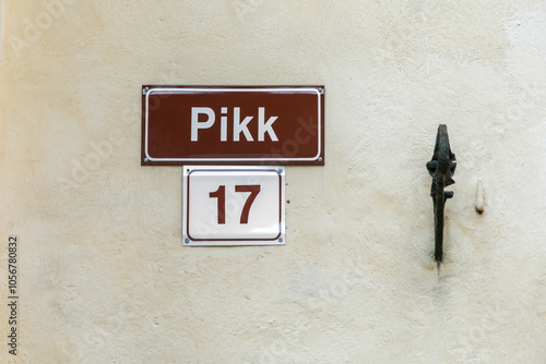 old enamel streetname pikk in Tallinn, Estonia at an old wall in the old town photo