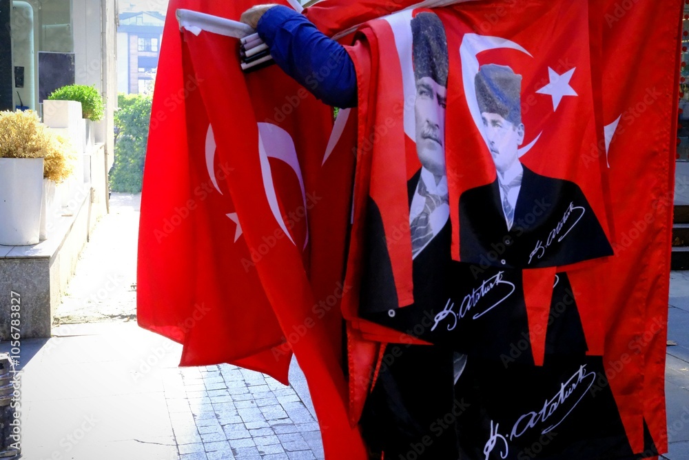 Fototapeta premium Street vendor selling Turkish flags. 29 October Republic Day. 10 November commemoration of Atatürk. April 23 National Sovereignty and Children's Day. 19 May Youth and Sports Day. 30 August Victory Day