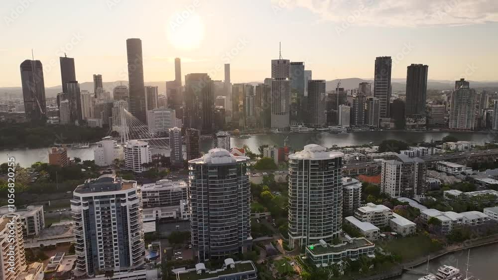 Sun on horizon over Brisbane city landmarks and Kangaroo Point buildings. Drone cityscape. Sun on horizon over Brisbane city landmarks and Kangaroo Point buildings. Drone cityscape.