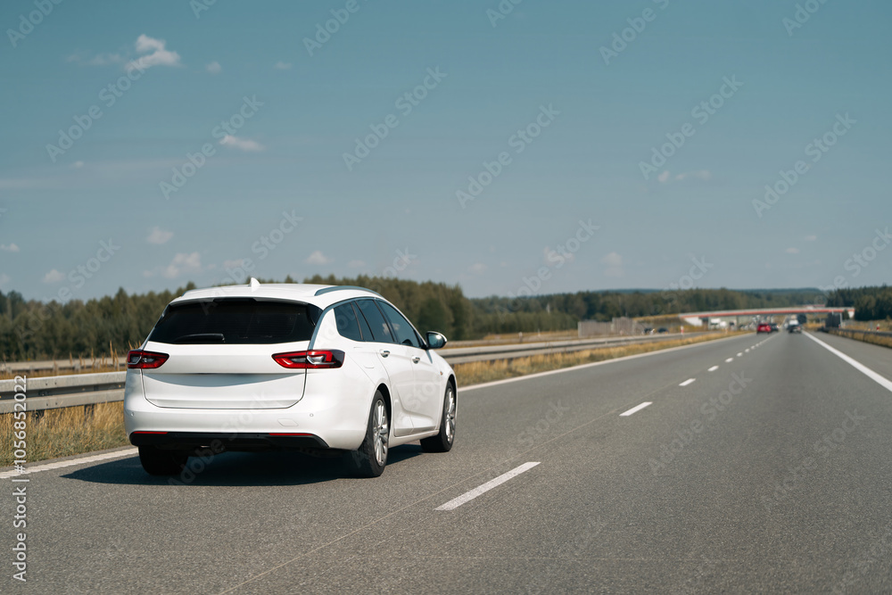 Wagon car cruising down an empty highway Wagon car cruising down an empty highway