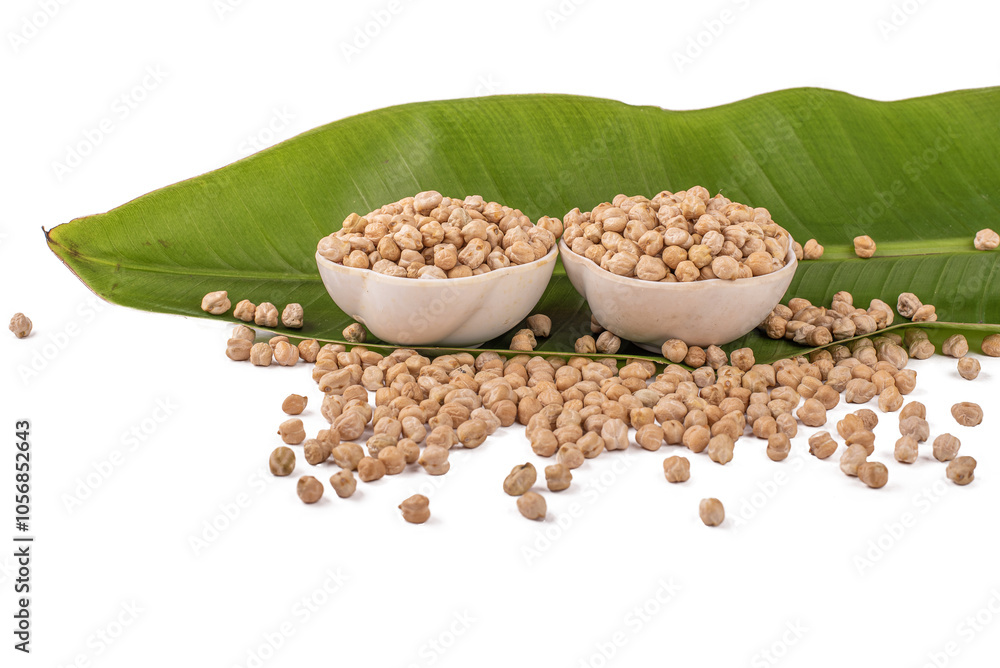 Chickpeas, raw and uncooked. Full body photo of dry yellow colored shelled garbanzo beans on a white background. Close up view of chickpeas for cooking or health food concept. A handful of chickpea Chickpeas, raw and uncooked. Full body photo of dry yellow colored shelled garbanzo beans on a white background. Close up view of chickpeas for cooking or health food concept. A handful of chickpea