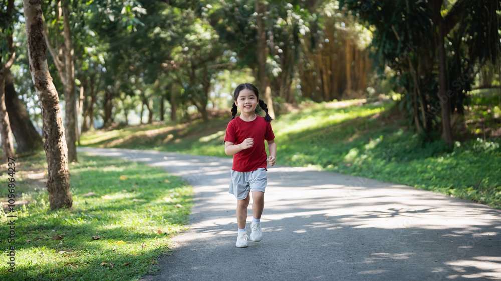 Happy baby Asian girl smiling. little girl running and smiling at sunset happy baby girl smiling. little baby running at sunset. cute baby running at playground garden.