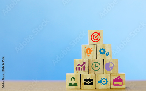 Concept of business strategy and action plan. Wood cube block stacking with icon photo