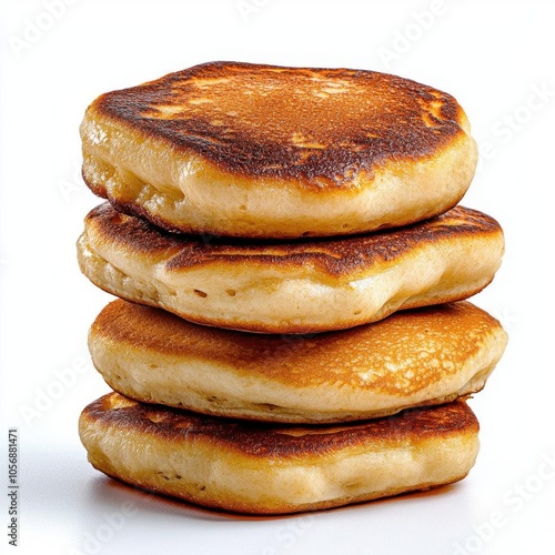 A photostock of freshly baked pancakes stacked on a white background, warm and fluffy. photo