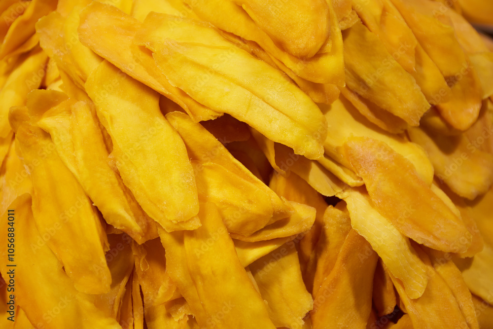 Dried mango slices for sale in the market, Close-up of a dried mango slices background Dried mango slices for sale in the market, Close-up of a dried mango slices background