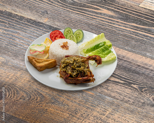 Traditional Indonesian Food - Ayam Penyet, Fried Duck, Green Sambal, Siomay Batagor, Soto Betawi, Rib Soup, Satay, Meatball photo