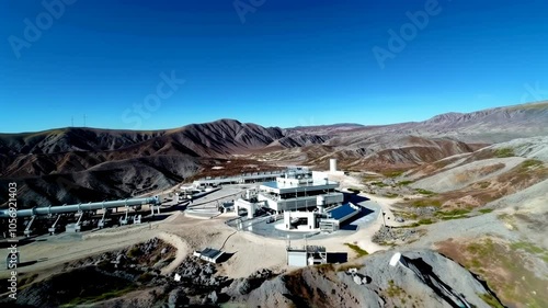 Wallpaper Mural Aerial view of remote industrial facility surrounded by rugged mountains under clear blue sky Torontodigital.ca