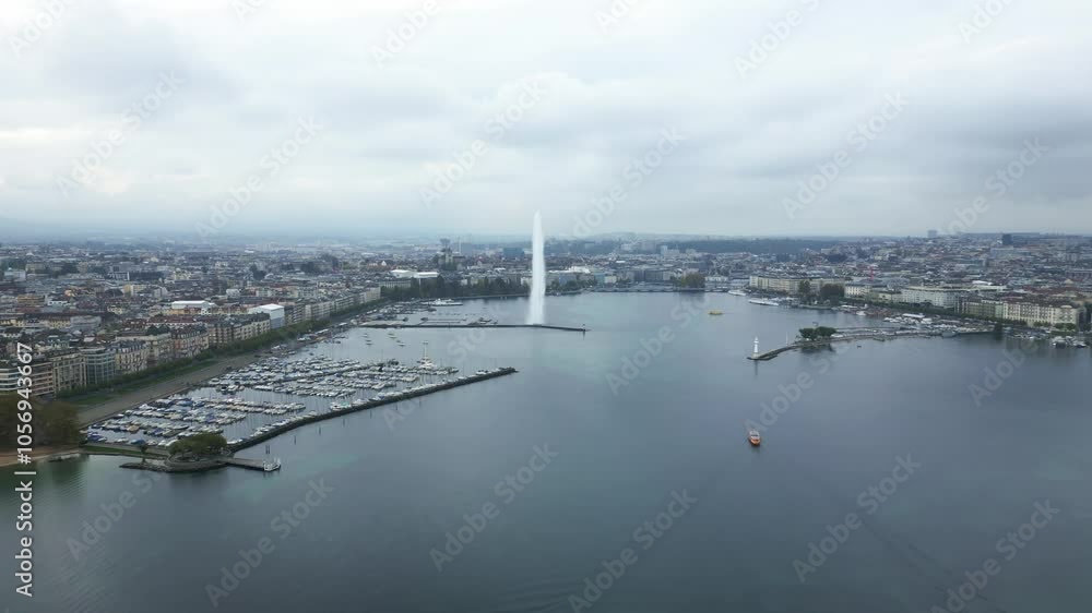 Crane up establishing drone shot of water fountain of Geneva in Switzerland Crane up establishing drone shot of water fountain of Geneva in Switzerland