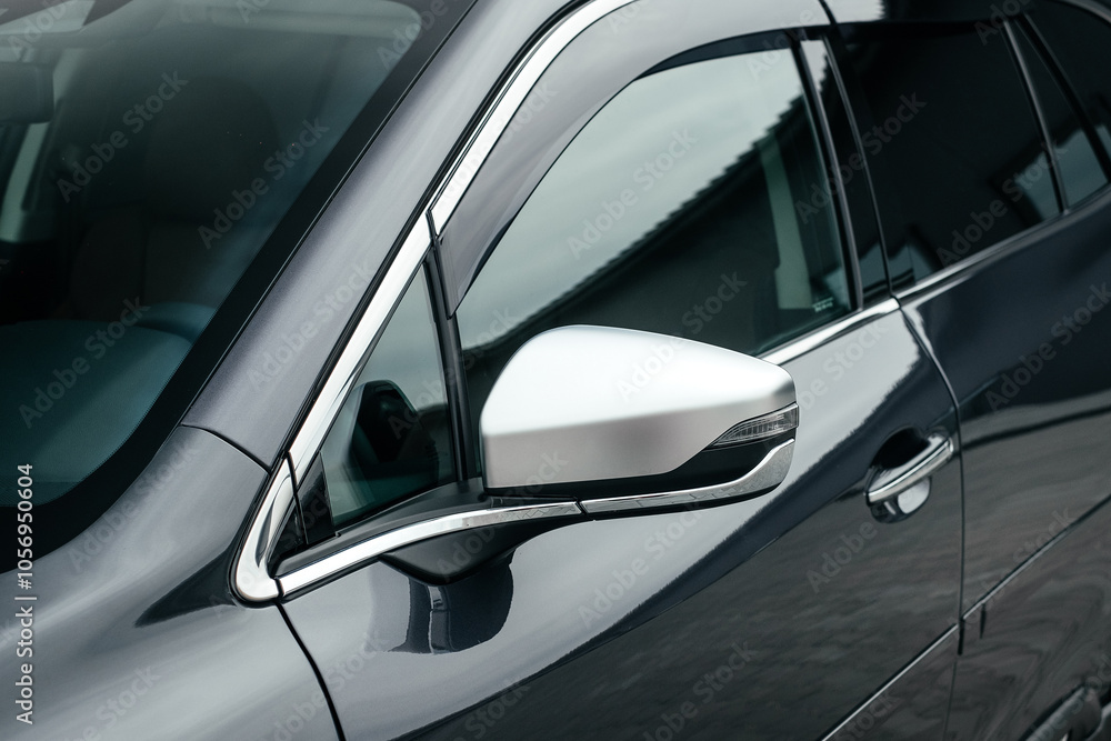 Modern subcompact crossover SUV, beautiful wheels, large chrome grille, gray color. Modern subcompact crossover SUV, beautiful wheels, large chrome grille, gray color.