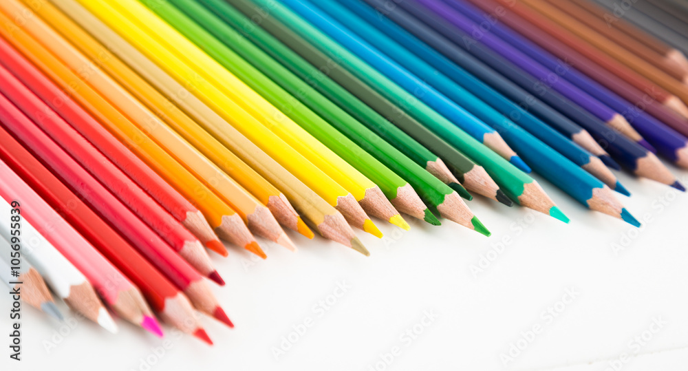 Colored pencils lying in irregular row Colored pencils lying in irregular row