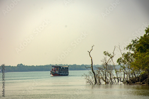 Tourist Boat Safari through River at Sundarban National Park, India photo