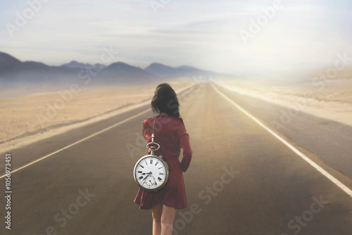 woman walking with a giant clock on her shoulders towards her destiny, concept of time passing photo