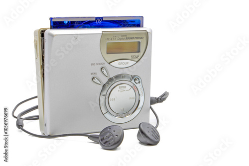 Close-up of a minidisc player and recorder with headphones and a minidisc disc isolated on white background