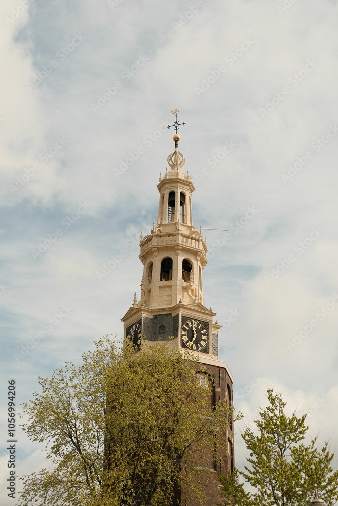 Montelbaanstoren Tower under gray cloudy sky  in Amsterdam, Netherlands, vertical shot