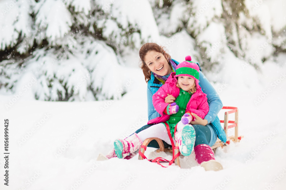 Child playing with snow in winter. Kids outdoors. Child playing with snow in winter. Kids outdoors.