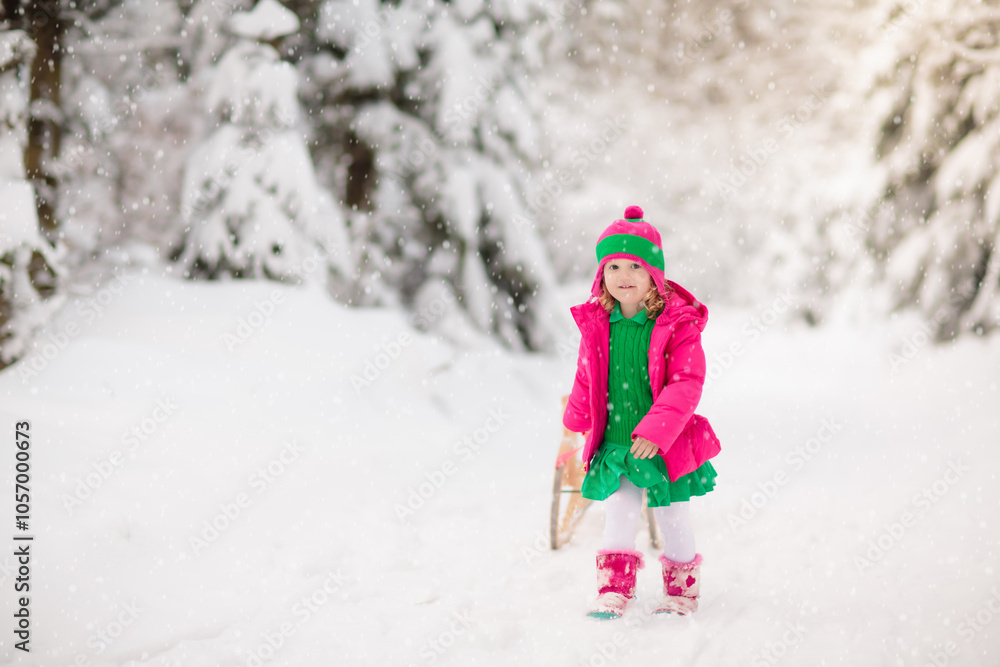 Child playing with snow in winter. Kids outdoors. Child playing with snow in winter. Kids outdoors.