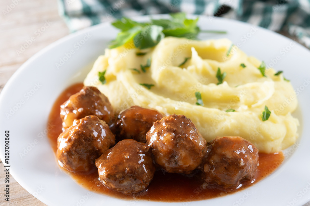 Meatballs with mashed potatoes on wooden table Meatballs with mashed potatoes on wooden table
