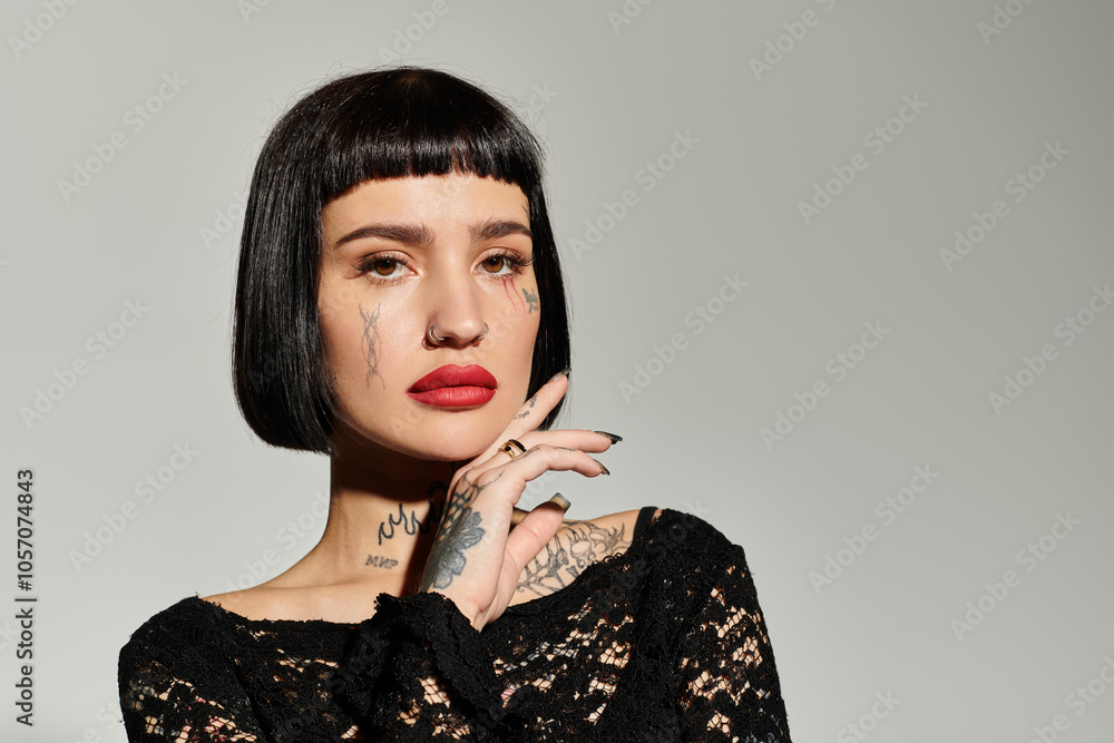 A stylish young woman showcases her tattoos and bold attire effortlessly. A stylish young woman showcases her tattoos and bold attire effortlessly.
