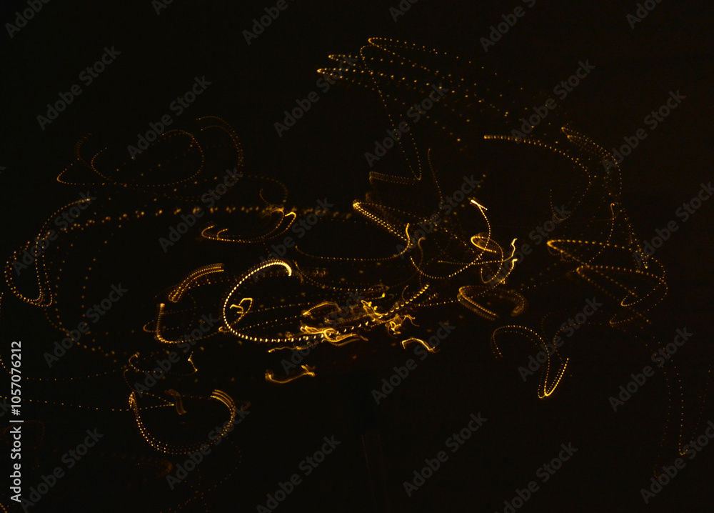 malowane światłem, obraz świetlny z wzorami i kształtami, abstrakcyjna fotografia z poruszającymi się światłami, Blurred Light painting, żółte maziaje świetlne, light painting photography, abstarct