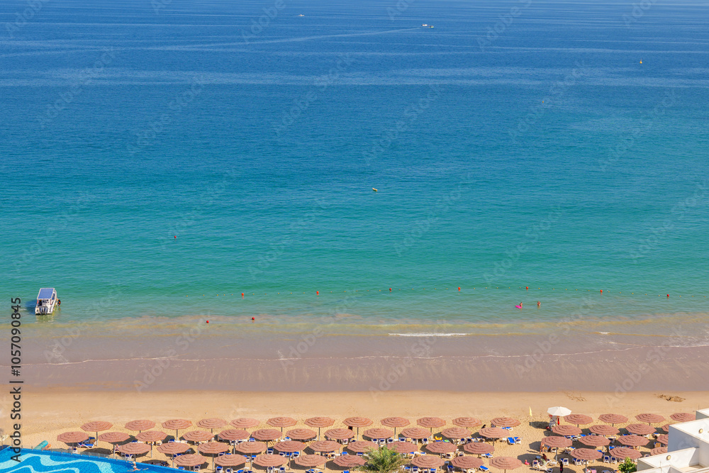 Luxury beach hotel on the seashore. Beach holidays on the coast of Fujairah, UAE Luxury beach hotel on the seashore. Beach holidays on the coast of Fujairah, UAE