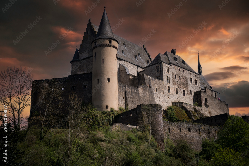 Medieval Vianden castle in Luxembourg under a moody sky Medieval Vianden castle in Luxembourg under a moody sky